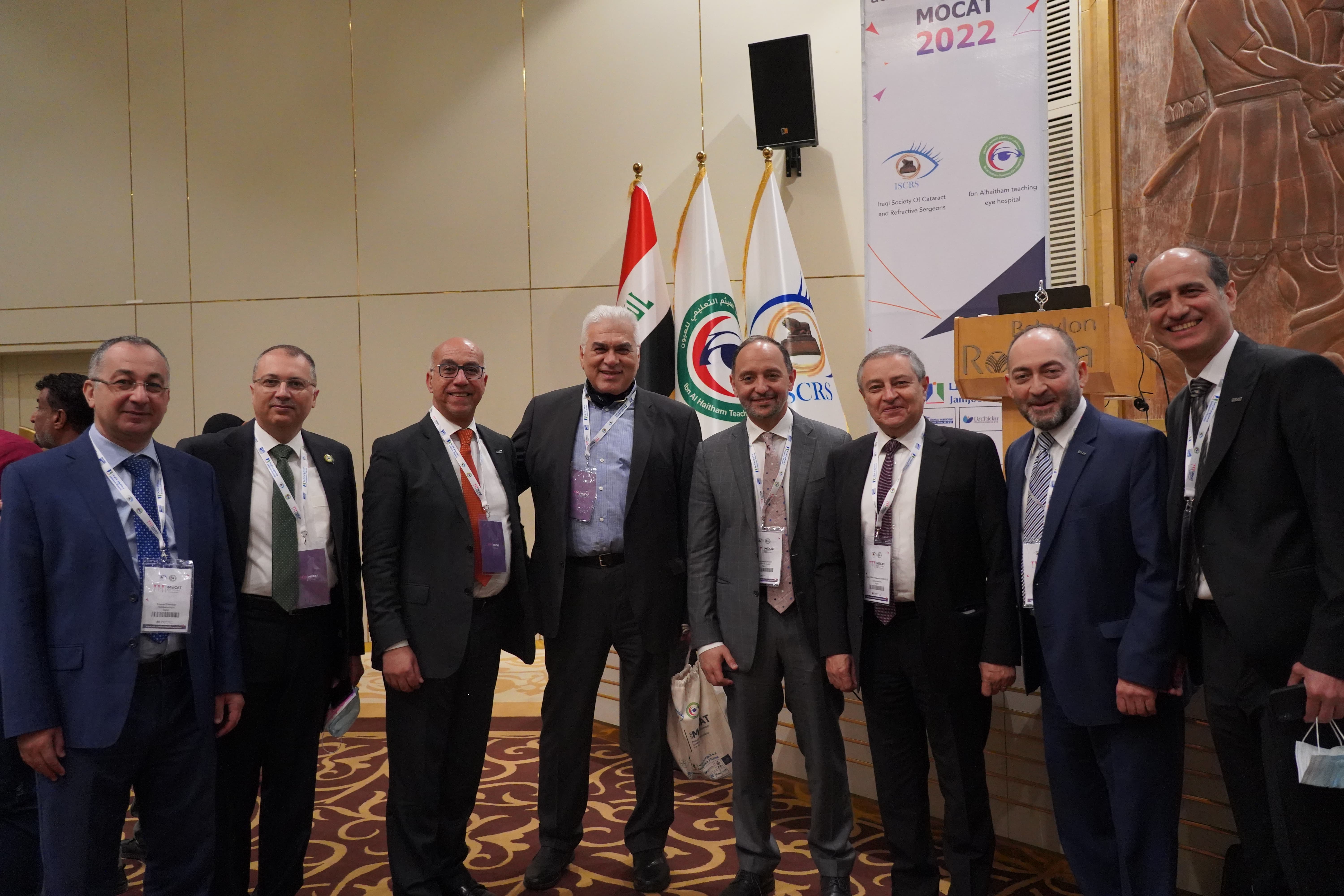 Committee members and VIPs group photo with Iraqi flags