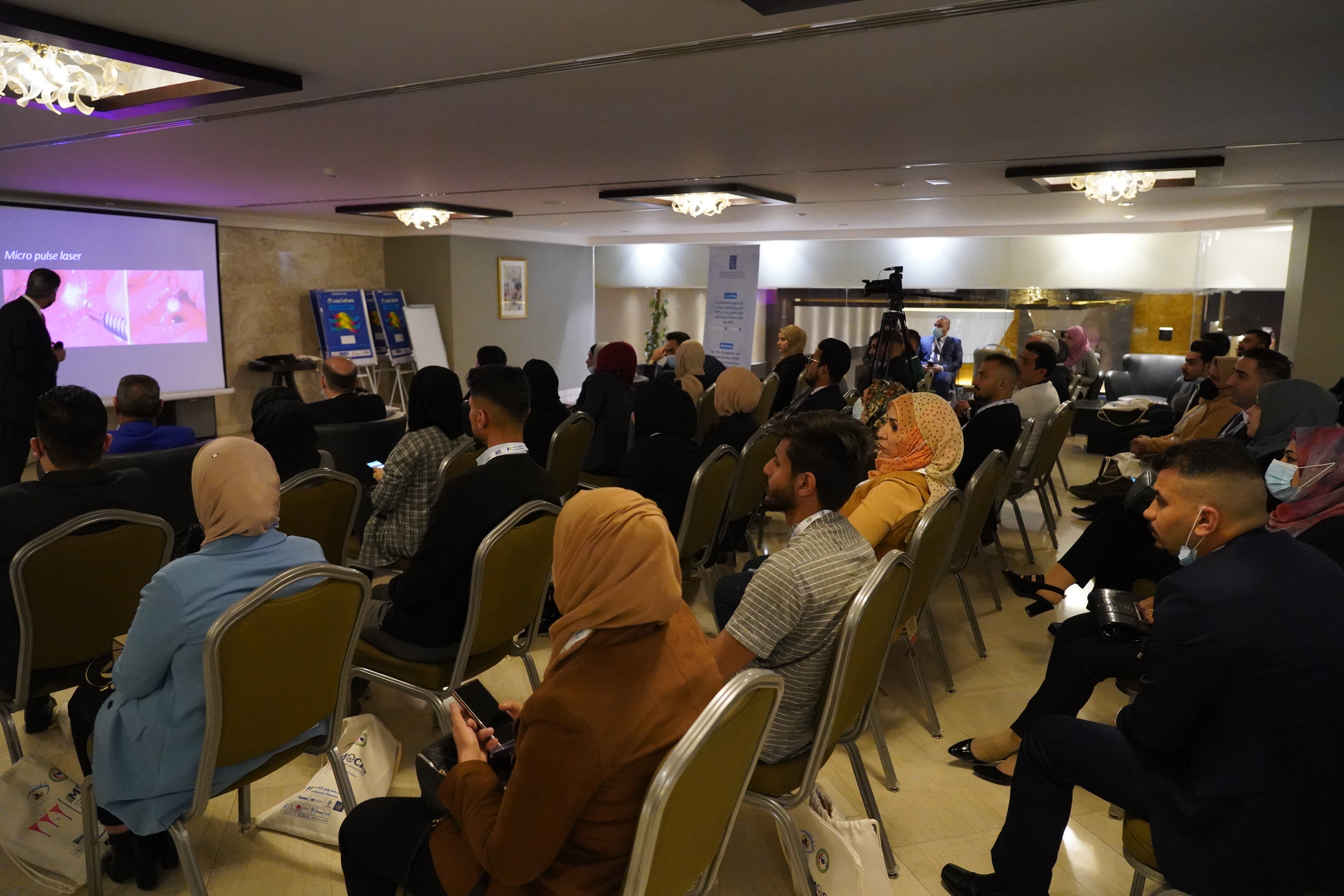 Audience attending educational session with medical presentation